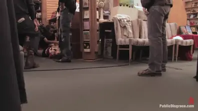 Redheaded bookworm gets humiliated and fucked in a bookstore