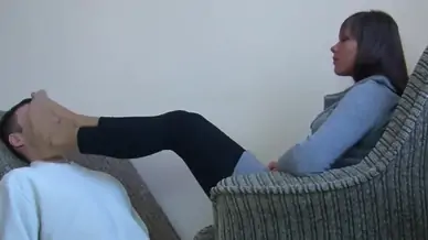 Sexy college girl gives a nice footmassage on face with nylons
