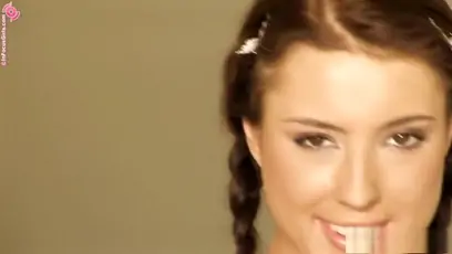 Sensual brunette with pigtails sits on a chair and makes herself cum