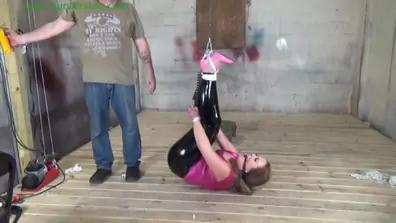Balltied suspended for spanking