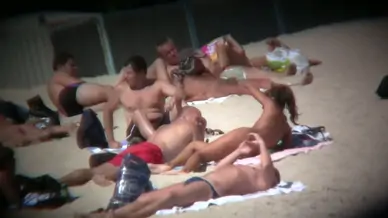 On the beach capturing a tanned and naked girl