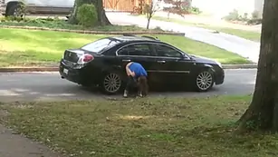 Girl caught on cam pissing on the car wheel