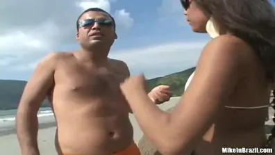 Tanned latin girl having fun with pal outside