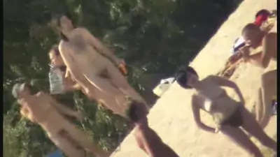 Stunning babes are filmed on on the beach