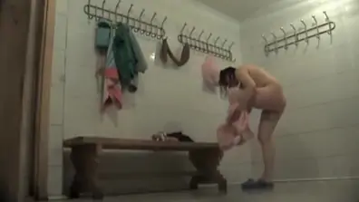 Cutie puts on sexy dresses in the changing room